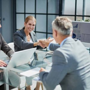 A group of colleagues reached an agreement in the negotiations by consolidating the deal with a handshake